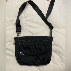 Lululemon cross body bag/fanny pack with adjustable strap in black.